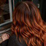 Long reddish-brown hair with warm cinnamon tones