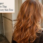 Long copper hair with golden highlights falling in soft waves